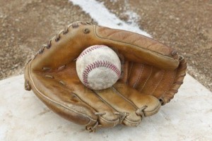 9737104-a-baseball-glove-in-a-baseball-diamond